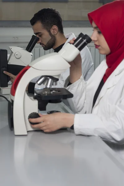 Group of young medical workers are working in lab as lab technician