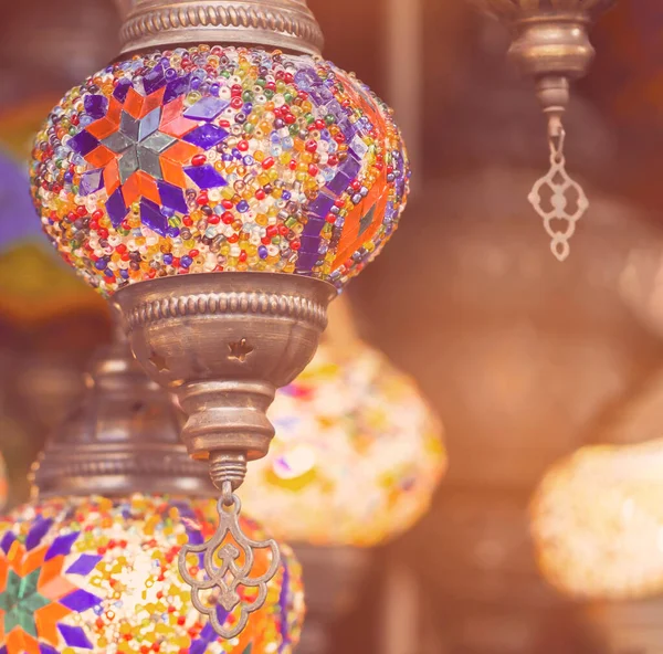 Middle Eastern lambas of different colors and sizes are hanging in the bazaar. — Stock Photo, Image