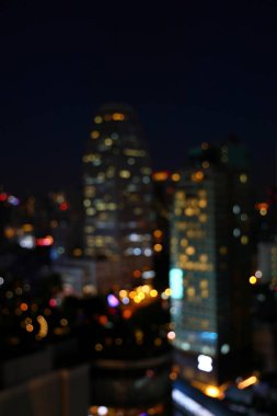 Soyut Bokeh şehir manzarası gece lambası, Şehir manzarası Bokeh, Bulanık Fotoğraf, Şehir Işığı Bokeh arka planı, Alacakaranlık Zamanında Bulanık Şehir.
