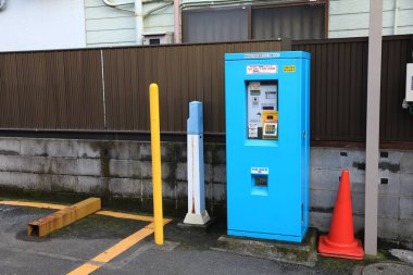 KAMAKURA, JAPAN - MAY 2018 : parking ticket machine on service at parking lot near Kotoku-in Temple.