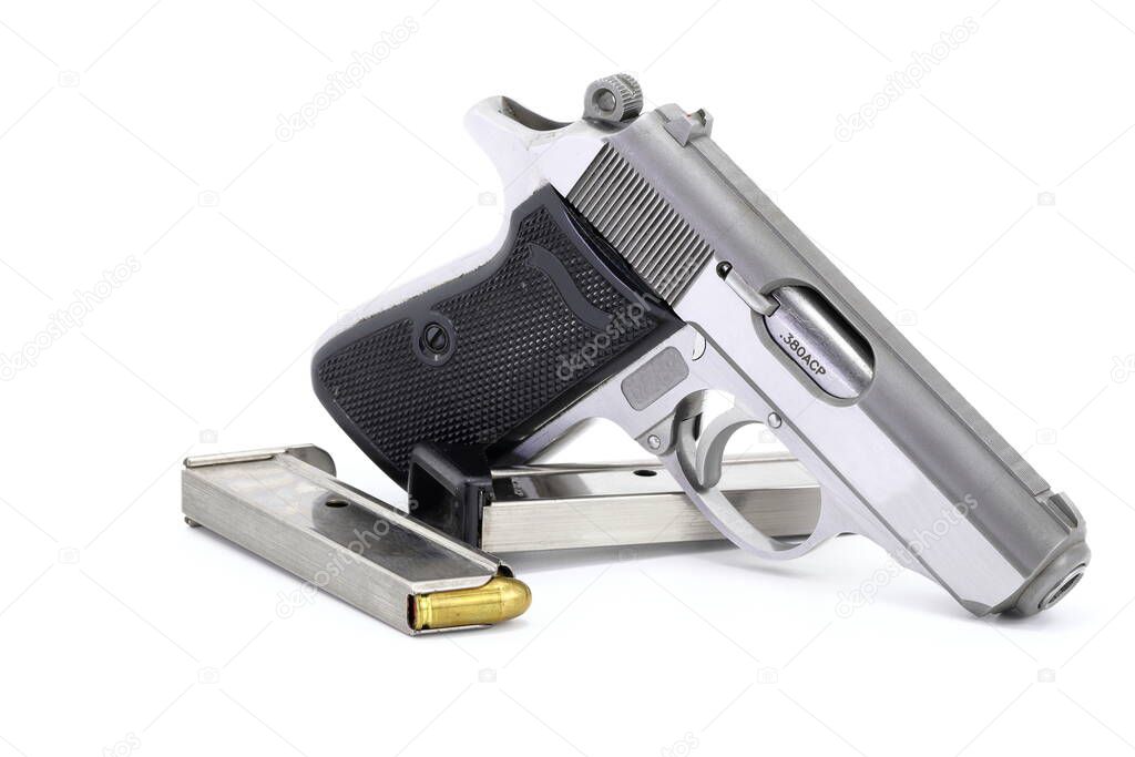 The compact Semi automatic pistol, stainless steel PPKs pistol with spare magazines right side view, Ready for use, lying isolated on white background. 