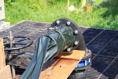 Dewatering pump with connected pipes and hoses of flood management system. 