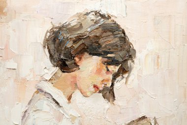 .Genç bir kız, sıcak bir arka plan üzerine ilginç bir kitap okuyor.. 