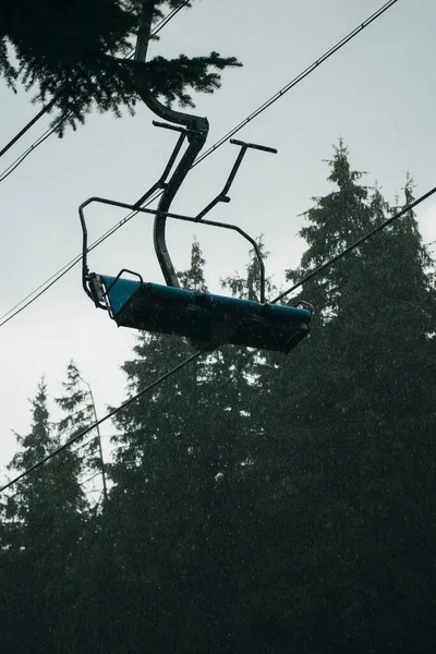 ski lift during heavy rain