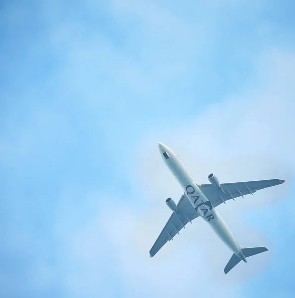 Silhouette of an airplane on sky background. Commercial airplane jetliner flying above clouds in beautiful day light. Flight travel transport airline background concept. Airplane in the sky