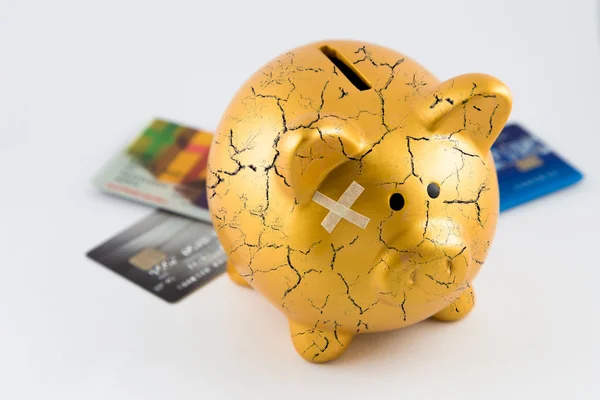 Concept of broken gold piggy bank — Stock Photo, Image