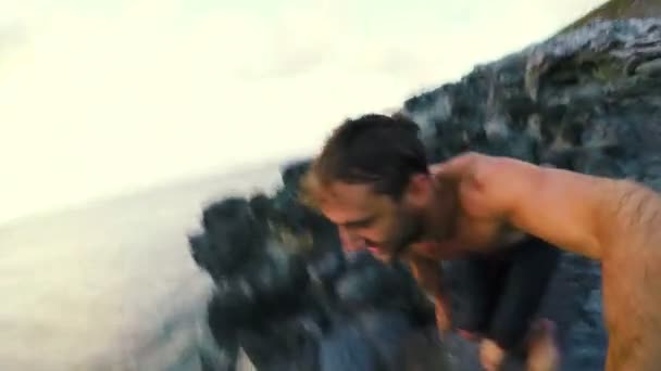 Extreme POV Cliff Jump into Hawaiian Ocean at Sunset. Fun Point of View. — Stock Video