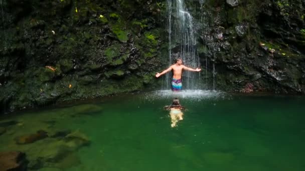 Couple Swims To Waterfall — Stock Video