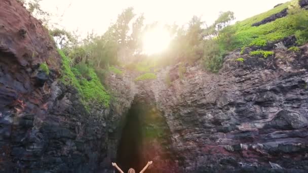Young Attractive Woman Standing On Sea Cliff Looking Up at Sun Amazing View. Victory Pose Arms Up — Stockvideo
