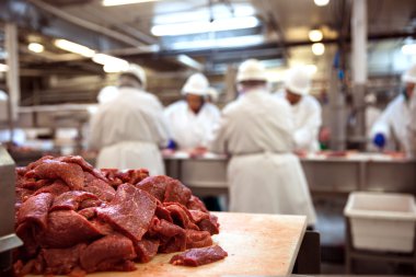 Pile of raw meat exposed and uncovered at meat packaging facility clipart