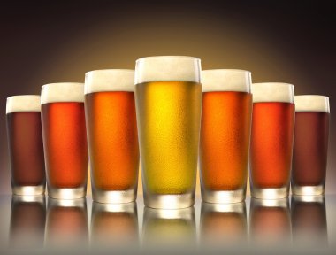 A tasty delicious row of a variety craft brew tap beers in pub glasses on reflective surface clipart