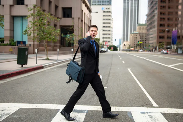 Business man executive crossing the street on the way to work late for appointment — Stock Photo, Image