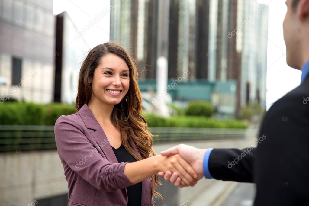 Pretty female businesswoman new career interview client handshake employment