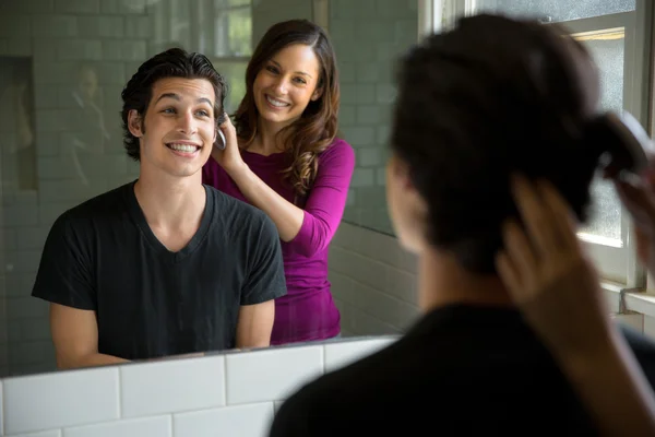 Woman styles mans full head of thick hair after regrowth growth medication success