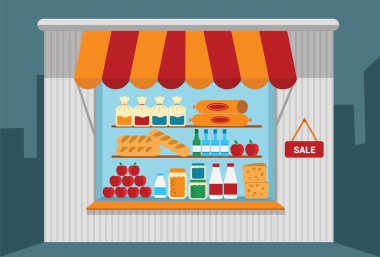 Mal ile açık raflar ile küçük dükkan.