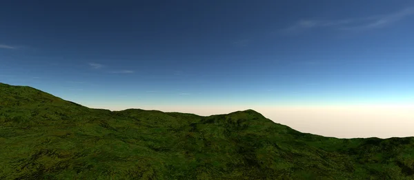 Vista de uma pequena montanha verde com nevoeiro no horizonte — Fotografia de Stock