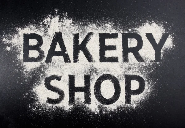 ベーカリー ショップ単語は小麦粉から成っています。店のロゴを焼く. — ストック写真