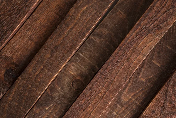 Estructura diagonal de madera oscura, tablones de madera vieja marrón de fondo . — Foto de Stock