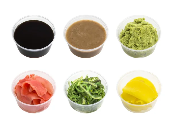 Soy sauce, wasabi, pickled ginger, radishes chuka and tahini in small bowl isolated on white background — Stock Photo, Image