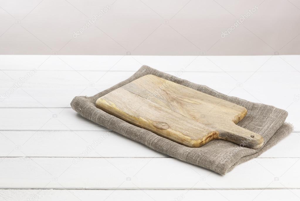 Cutting board on wooden table