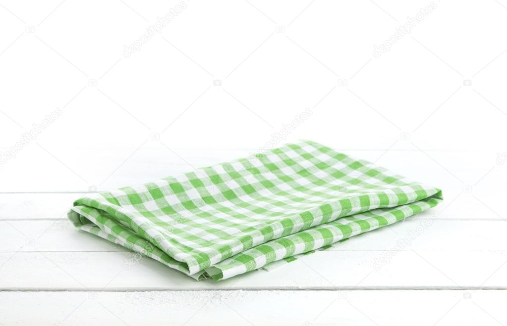 Table with green tablecloth for product montage