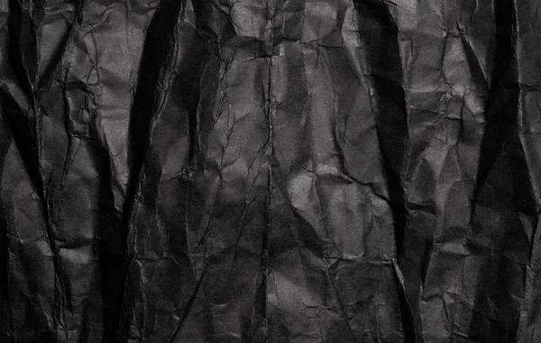 Black crumpled paper texture, grunge background — Stock Photo, Image