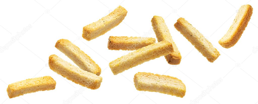 Falling bread croutons, salted bread sticks isolated on white background