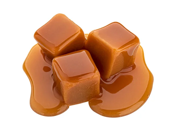 Caramel candy and caramel sauce isolated on white background — Stock Photo, Image