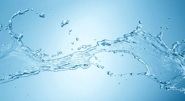 Salpicadura de agua aislada sobre fondo azul —  Fotos de Stock