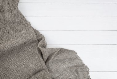 Beyaz ahşap masa peçeteye. Üstten Görünüm.