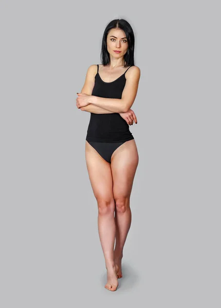 Slender Woman Standing Black Bodysuit Gray Background — Stock Photo, Image