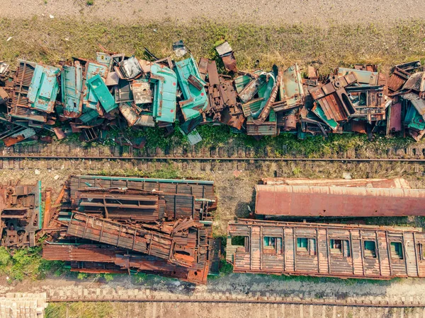 Railway trains, scrap metal dump at the railway station, top view.