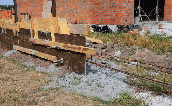 Close up on Building concrete foundation for new fence. — Stock Photo, Image