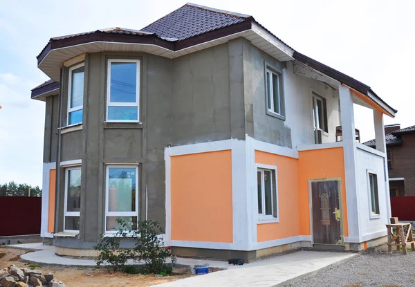 Close up on Painting and Plastering Exterior House Wall. Facade Thermal Insulation and Painting Work — Stock Image Close up on Painting and Plastering Exterior House Wall. Facade Thermal Insulation and Painting Work Royalty Free Stock Images