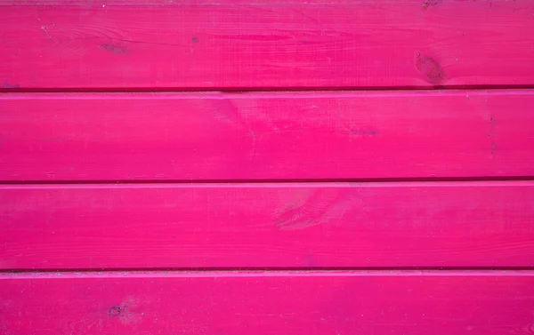 Roze houten achtergrond. Houten planken beschilderd met roze verf getextureerde achtergrond. — Stockfoto