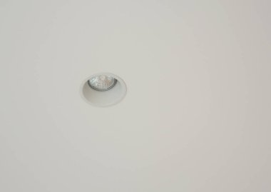 A close-up on a built in ceiling LED light, home interior ceiling spotlight. 