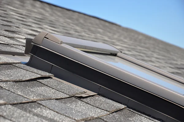 Roof window, skylights  with closeup focus on bitumen-based waterproofing membrane areas. — Stock Photo, Image