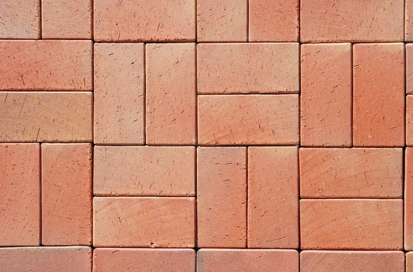 Pavimentadores de cerámica moderna roja. Pavimentos de piso en un camino, detalle de un pavimento para caminar, fondo texturizado — Foto de Stock