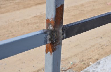Close up Weld on a Steel Iron Bar for a New Fence Frame. Welding is a Fabrication or Sculptural Process That Joins Materials, Usually Metals