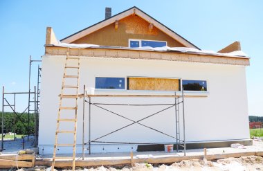 Construction or repair of the rural house with insulation, eaves,  windows, wall insulation,chimney, roofing, fixing facade, plastering and using color.