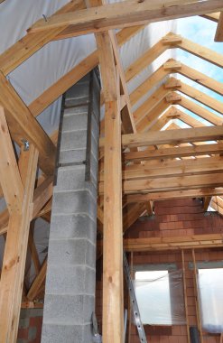 Building New Modular Pumice Stone Chimney Inside of Attic Room and Roof Construction Interior