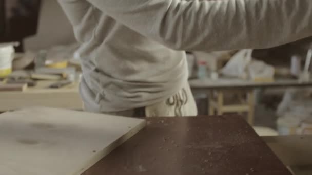 Professional woodworker connects two wooden polished board. Furniture. Process — Stock Video