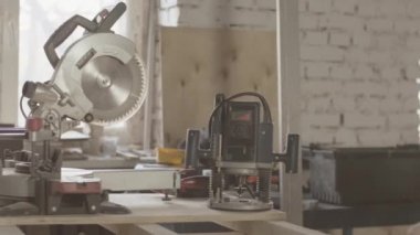 Woodworker measure wooden board by straightedge. Polishing, circular saw