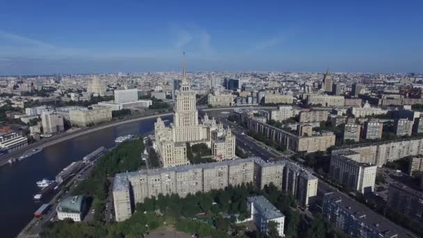 Quadrocopter shoot panorama Moscow city in summer cloudless day. Building of Radisson Royal Hotel. — Stock Video