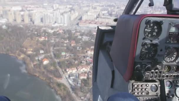 Pilot cabin in moment of fly helicopter above city. Control system. Camera inside. Transportation — Stock Video