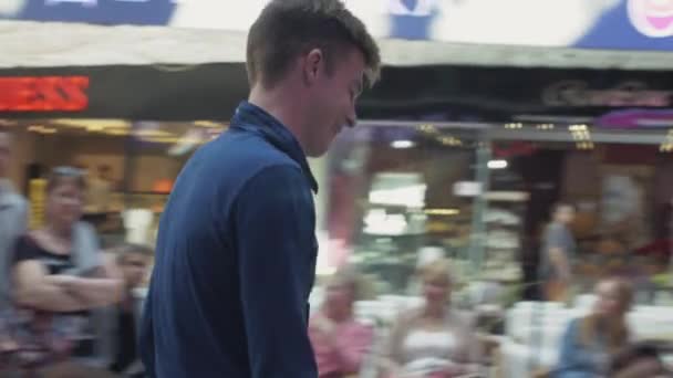 SAINT PETERSBURG, RUSSIA - JUNE 4, 2016: Boy come for coupon to woman in shopping center. Entertainment event. Winner — Stock Video