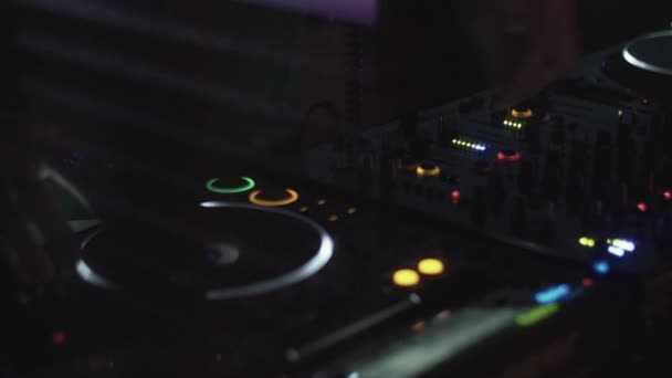 Dj spinning at turntable on party in nightclub. Performance. Equipment. Mixing — Stock Video