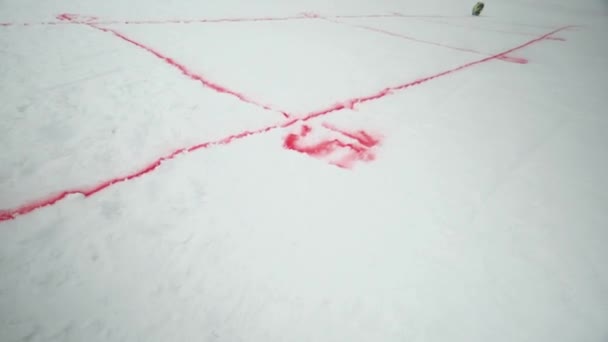 Red spray marking on snowboarding trail. Snowy mountain. Contest. Ski resort. Challenge. Competition — Stock Video