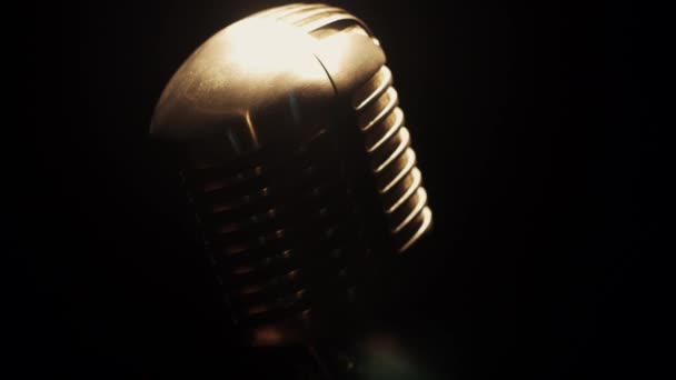View at concert glare microphone stay on stage in retro club under spotlight — Stock Video