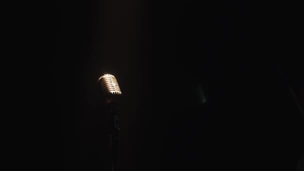 Scrubwoman in gloves with mop and bucket walk through stage. Vintage microphone. — Stock Video